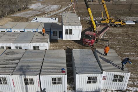 China has started erecting temporary housing units after an earthquake destroyed 14,000 homes